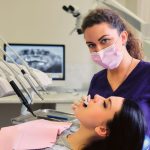 a woman is getting dental treatment
